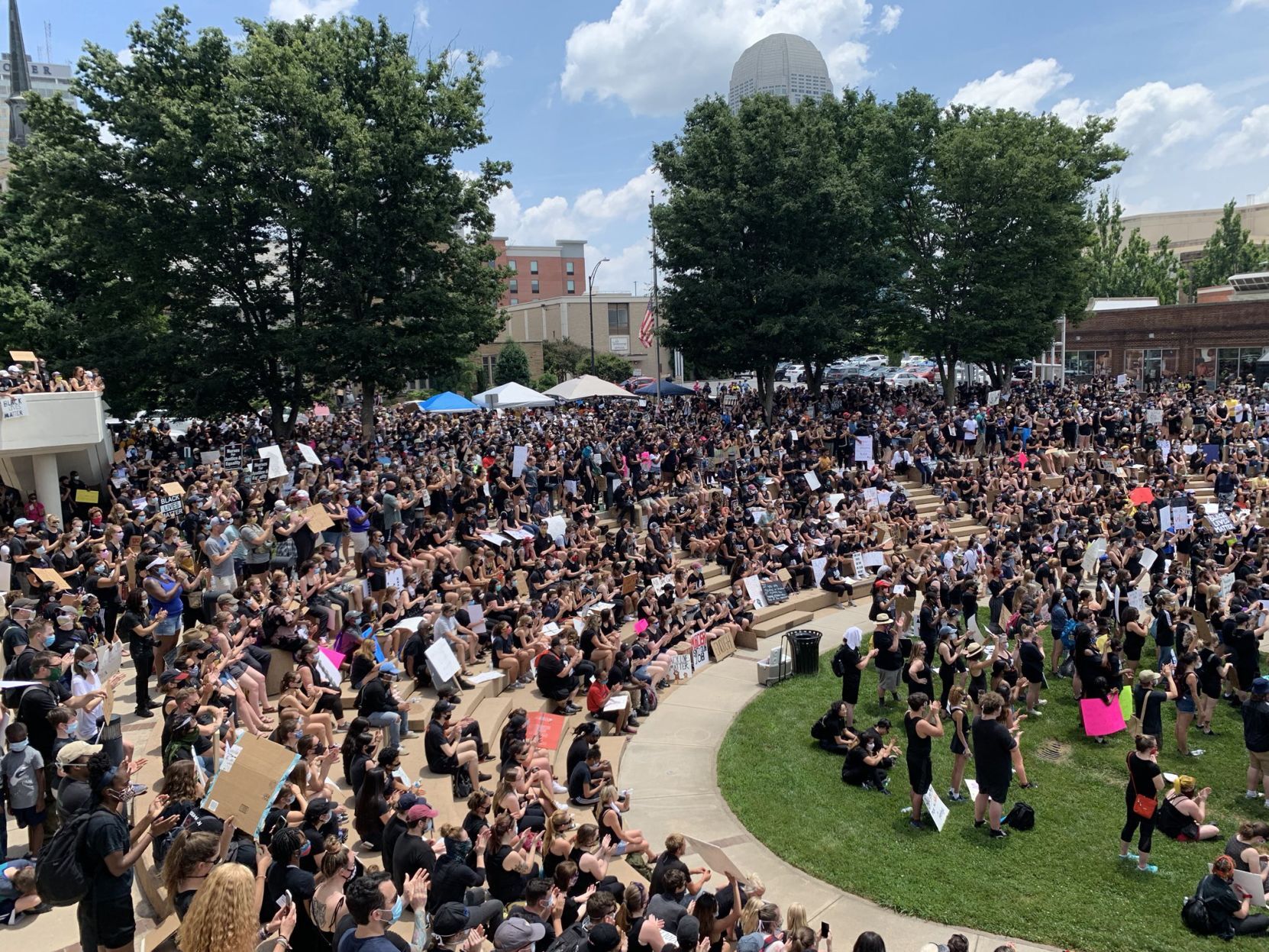 Protesters gather at Winston Square Park amphitheater